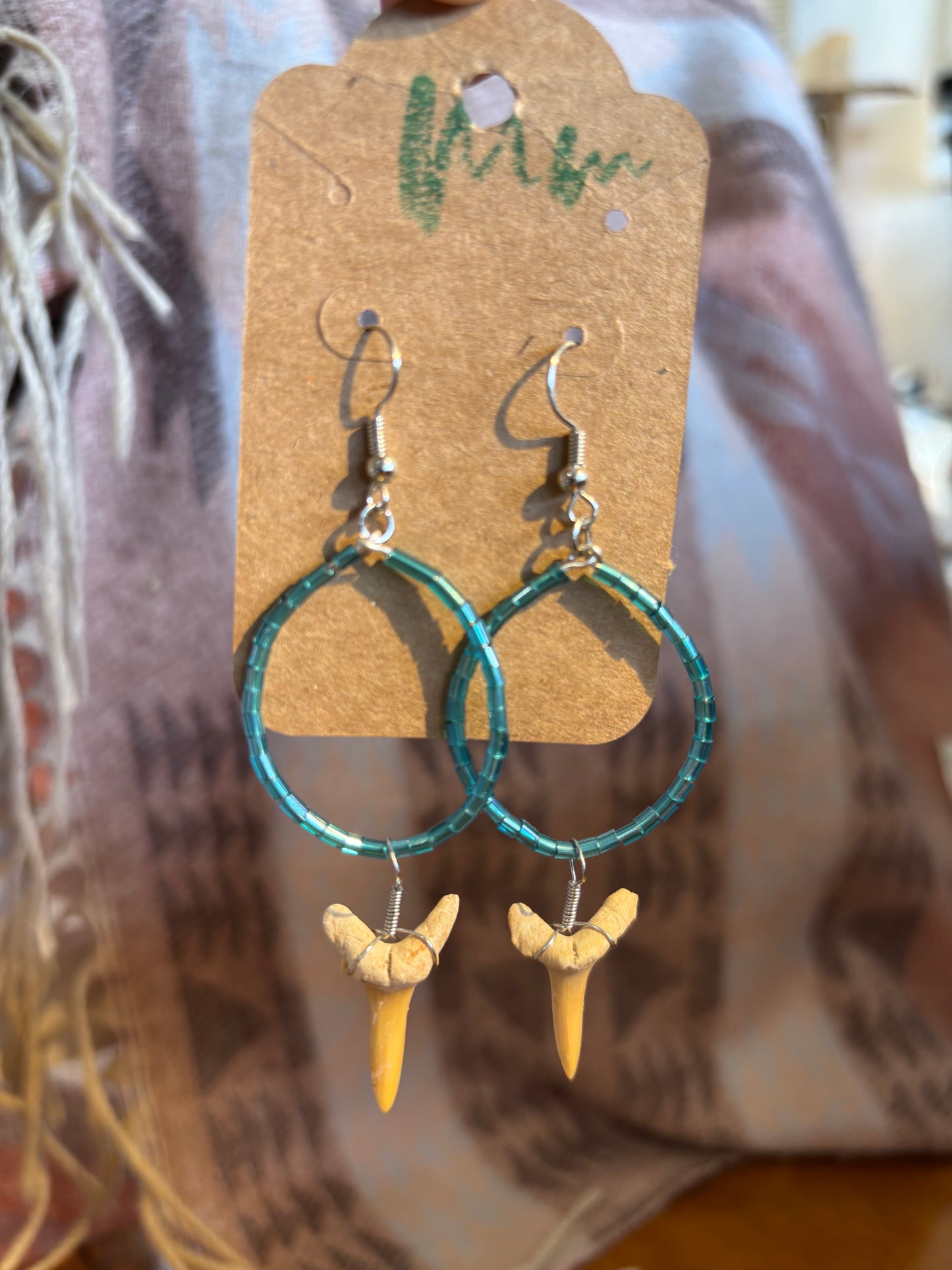 blue beaded earrings with small shark teeth