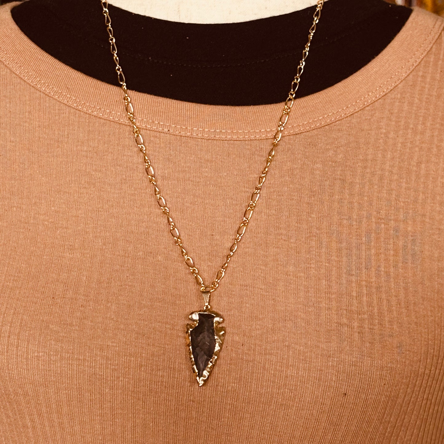 golden black arrowhead necklace